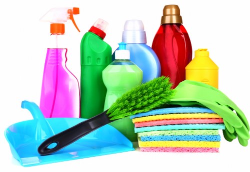 Carpet cleaning team preparing equipment safely